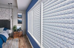 A bedroom with blue walls and sheer shades